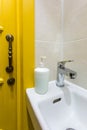 Toilet and detail of a corner shower cabin with wall mount shower attachment Ã¯Â¿Â½Ã¯Â¿Â½ bathroom of hotel Royalty Free Stock Photo